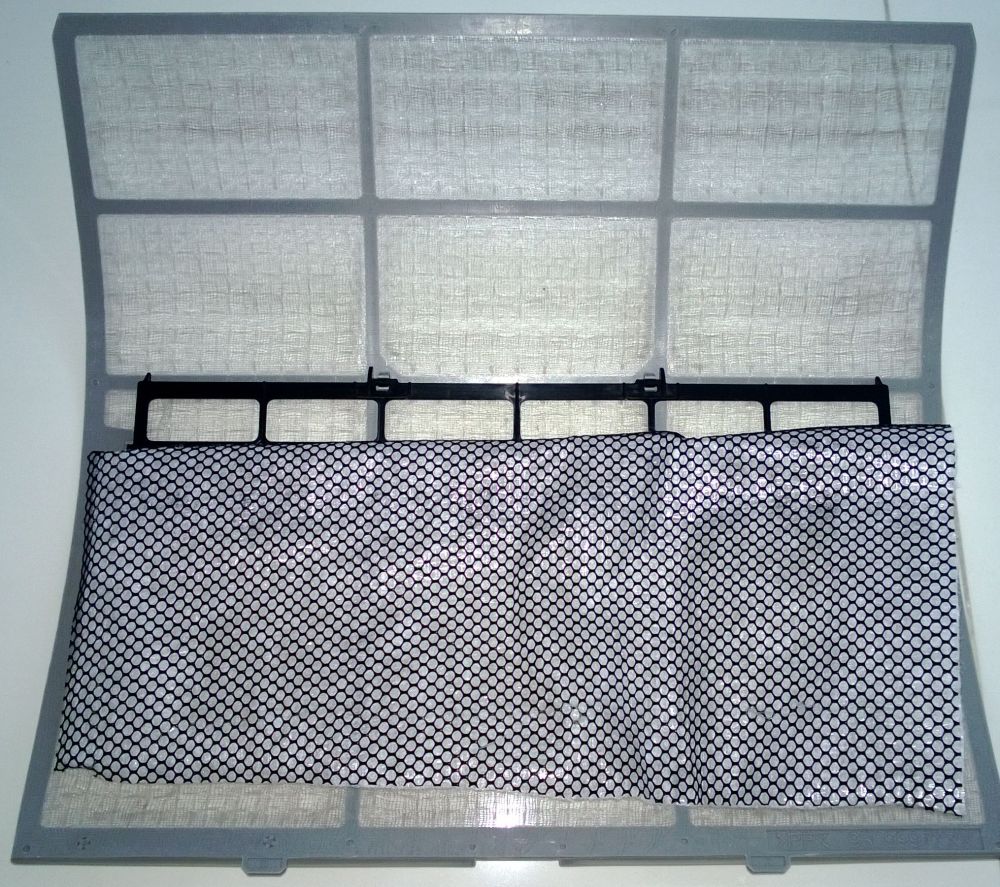 The black mesh is the carbon & the membrane filter is behind it. Just stick it or place it behind the normal air-con filter, then reinstall your air-con filter.